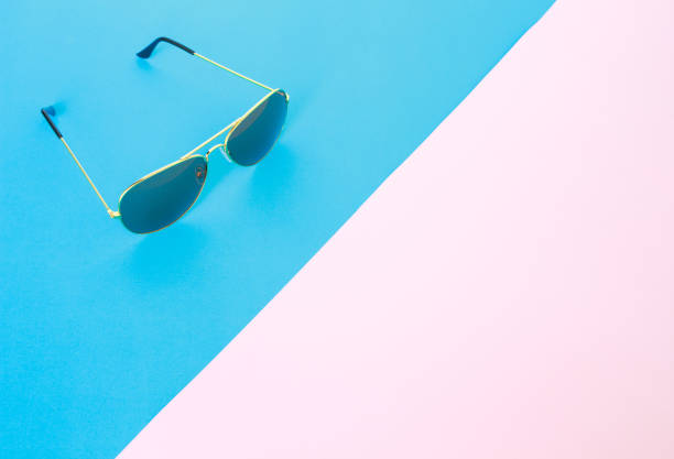 istock sunglasses on blue and pink rose quartz & serenity background 1030770300
