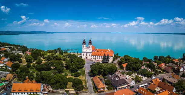 Tihany, Hungary - Aerial panoramic view of the famous Benedictine Monastery of Tihany (Tihany Abbey) with beautiful coloruful Lake Balaton at background