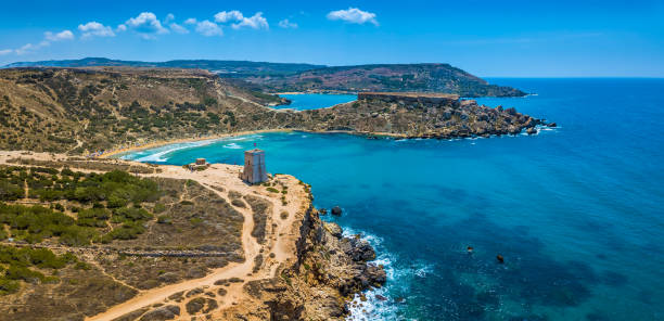 Ghajn Tuffieha, Malta - Aerial panoramic view of the beautiful Ghajn Tuffieha Bay, Ghajn Tuffieha Watch Tower and Riviera beach stock photo