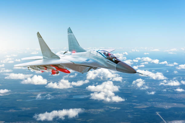 istock Combat fighter with weapons flying over the clouds. 1030784572