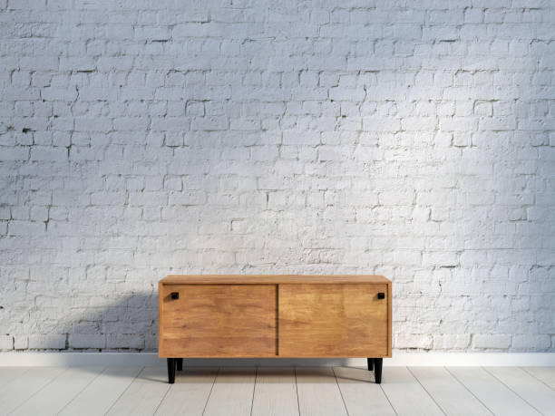 istock vintage wooden commode at brick wall 1030787248