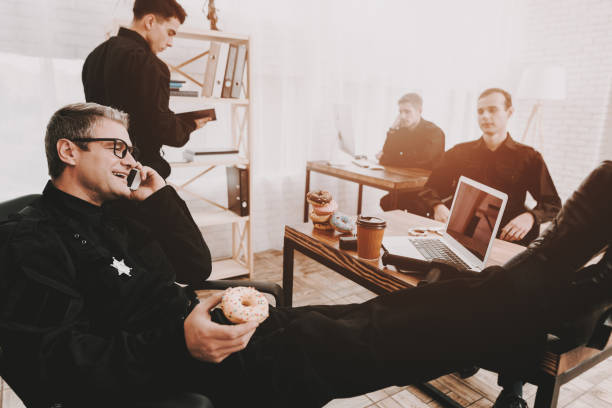 istock Policeman In Department Office. Relaxing Concept. 1030788036