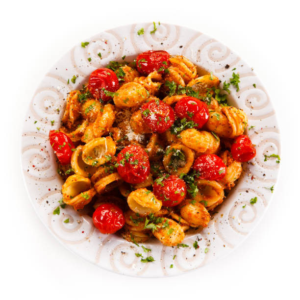 istock Pasta with meat and vegetables on white background 1030792348