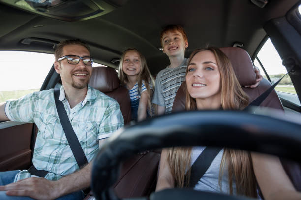 istock young parents go in the car 1030796116