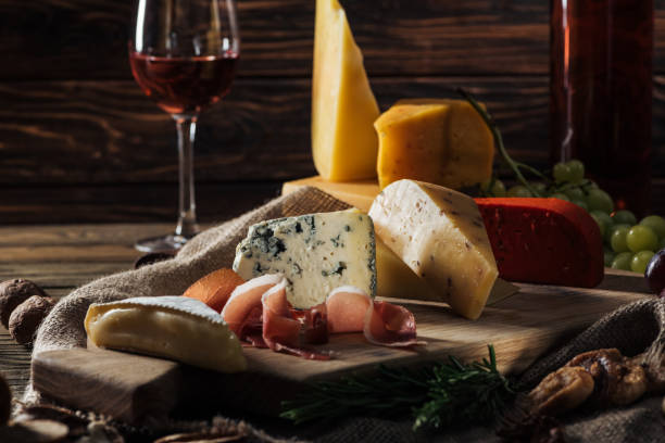 istock different types of cheeses and prosciutto on wooden board 1030796130
