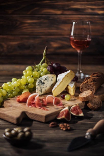 istock different types of cheeses and prosciutto on cutting board 1030798214