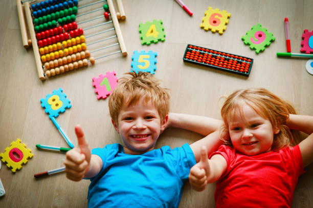 istock happy kids enjoy learning numbers, arithmetic, abacus calculation 1030798858