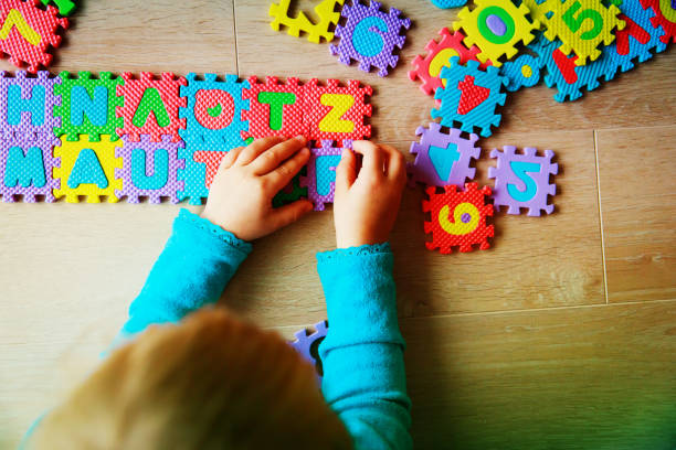 istock little girl learning numbers, education concept, education 1030799104