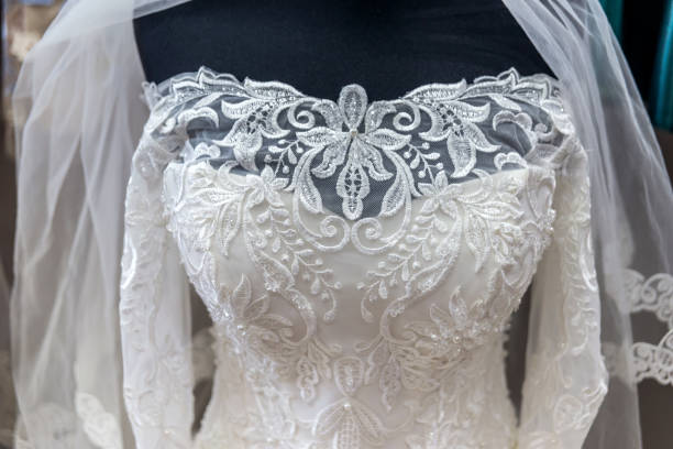 istock Close-up on white wedding dress on mannequin 1030799790