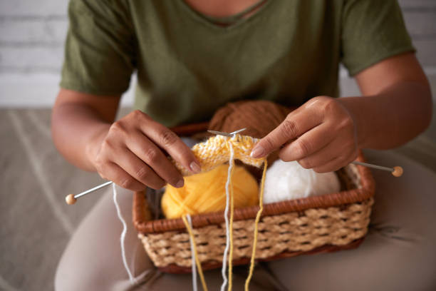 istock Crop lady knitting at home 1030800100