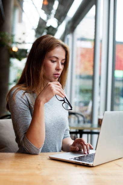 istock business woman behind her desktop 1030803436