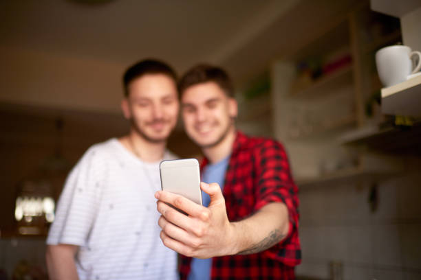istock Gay couple taking a selfie image 1030806406