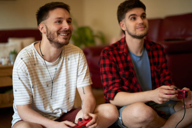istock Gay couple playing video games 1030806972
