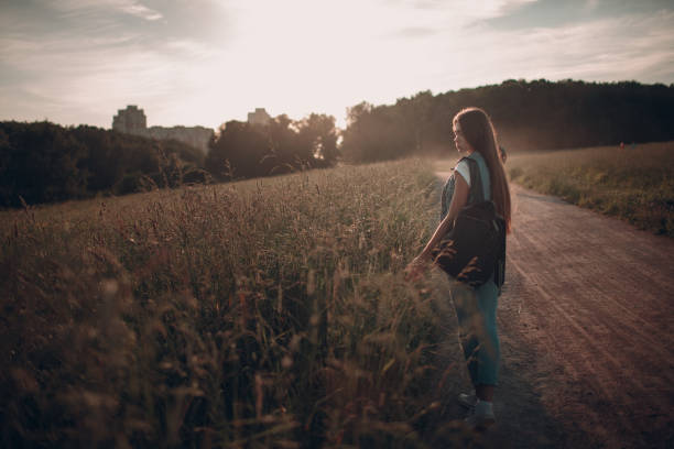 istock Beautiful young lady in park 1030812588