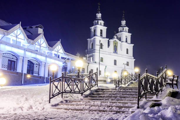 Holy Spirit Cathedral in winter Minsk at night. Christmas night magic Minsk city. Cityscape of Belarus capital town. Snowy Minsk at night. Famous church of Belarus. stock photo