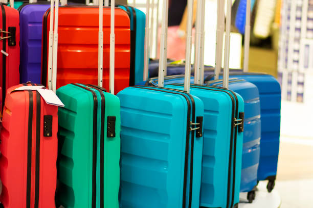 Suitcases in the shop window. Luggage bags in the store. Sale of suitcases for trips. stock photo