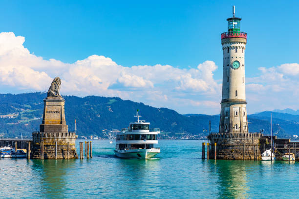 Lighthouse and lion statue in Lindau, Germany Scenic summer view of the lighthouse and lion statue in the harbor of the Old Town of Lindau on Bodensee or Constance lake in Bavaria, Germany bodensee stock pictures, royalty-free photos & images