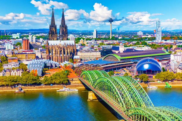 Aerial panorama of Cologne or Koln, Germany Scenic summer aerial panorama of the Old Town pier architecture with Cathedral Church and Hohenzollern railway bridge over Rhine River in Cologne or Koln, North Rhine-Westphalia, Germany koln germany stock pictures, royalty-free photos & images