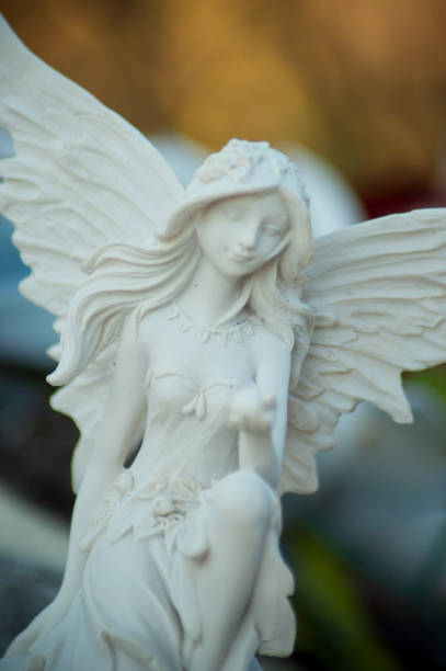 istock stoned angel on tomb in cemetery 1030826384