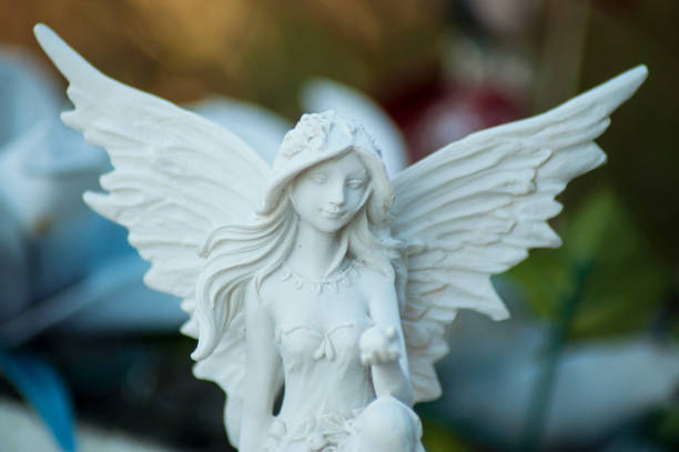 istock stoned angel on tomb in cemetery 1030827424