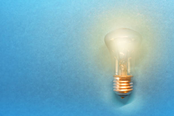 istock light bulb with glow for an idea on a blue background 1030836600