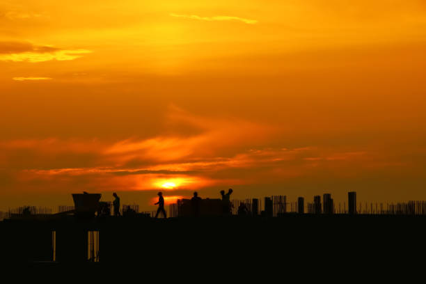 istock silhouette of construction in the evening on the sunset 1030836738