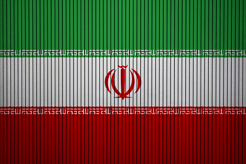 Painted national flag of Iran on a concrete wall