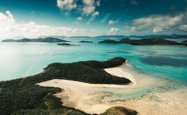 istock whitsunday beach with a boat 1030841142