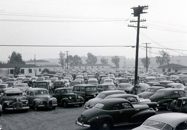Public parking in Los Angeles, 1951 Los Angeles, California, USA, 1951. Public parking in Los Angeles. Possibly the car parking in front of the Olypiastadium (Memorial Coliseum). vintage car photos stock pictures, royalty-free photos & images