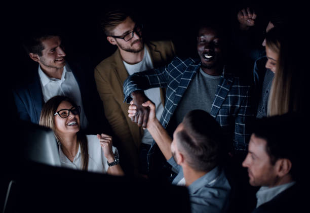 istock close up.successful business team working in the evening 1030849802