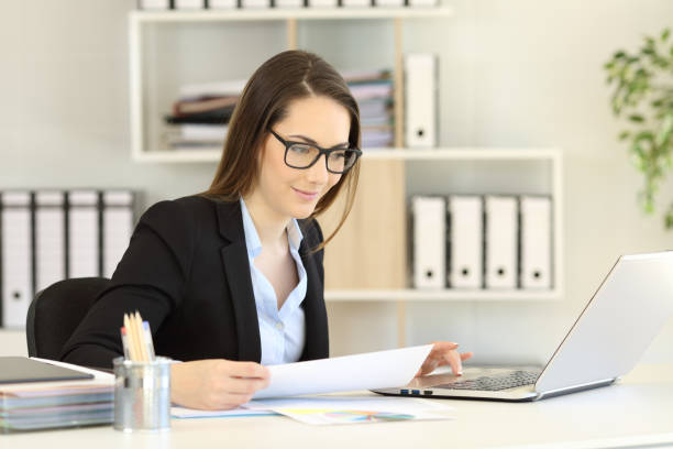 istock Office worker wearing eyeglasses working online 1030850456