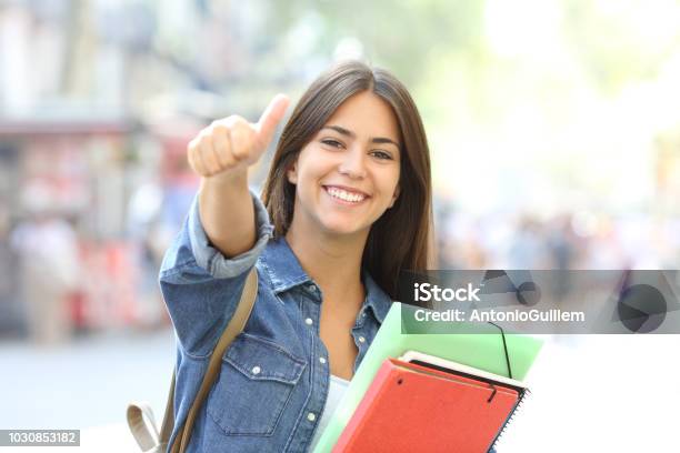 Happy Student Posing With Thumbs Up In The Street Stock Photo - Download Image Now - Student, Education, Teenager
