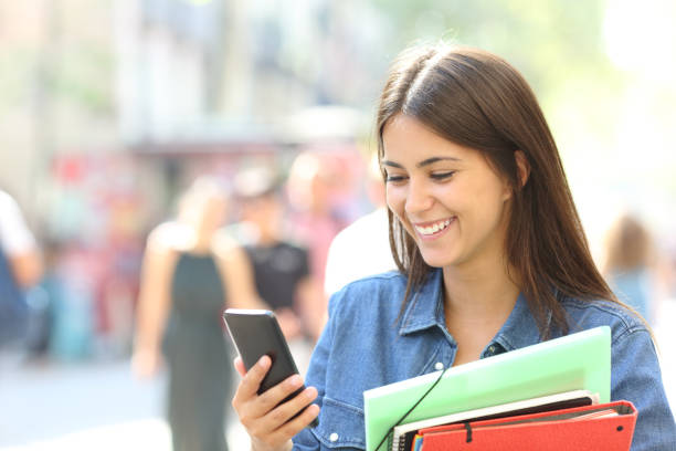 istock Student consulting online information in a phone 1030853424