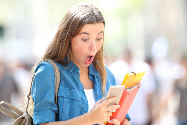 istock Surprised student receiving good online news 1030853686
