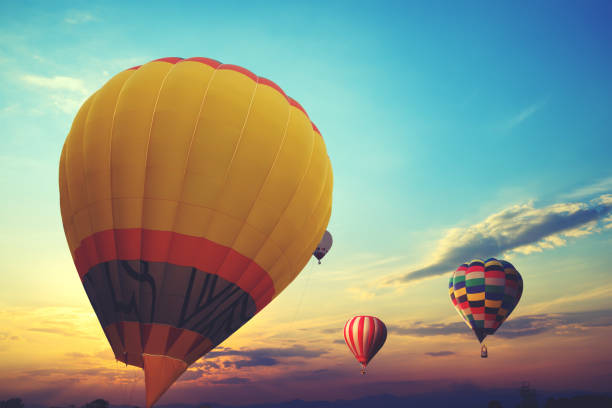 istock hot air balloon flying on sky at sunset 1030853818