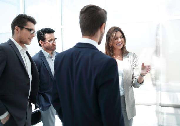 istock group of business people standing in a modern office 1030856840