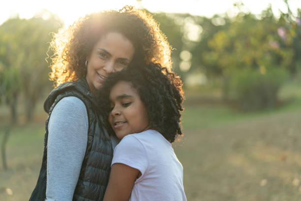 istock Daughter and Mother Embracing Portrait 1030857032