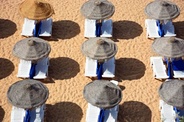 istock Sun loungers and parsols on Albufeira beach. 1030858654