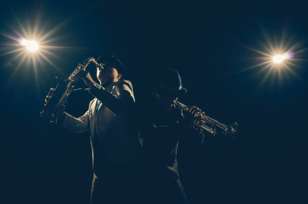 Musician Duo band playing the Trumpet with spot light and lens flare on the stage, musical concept stock photo