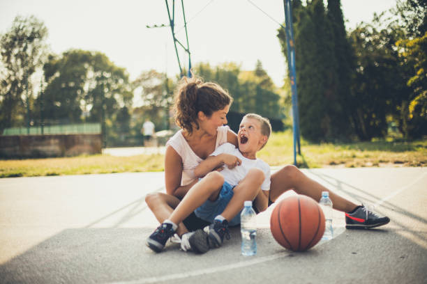 istock Mother and her son at playground have fun . 1030862486
