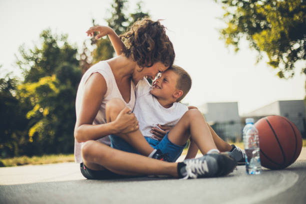 istock Mother and Son after basketball game. 1030862630