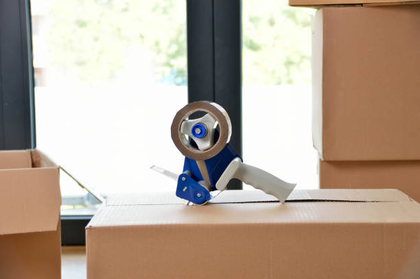 istock tape dispenser over a paperboard box 1030865890