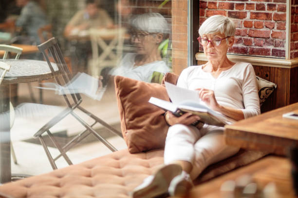 istock Senior woman reading a book 1030871150