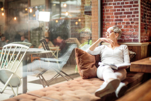 istock Senior woman holding a book 1030871358