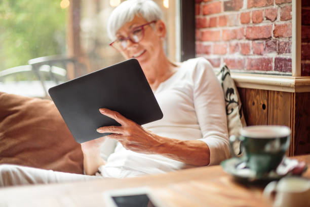istock Senior woman with digital tablet 1030873034
