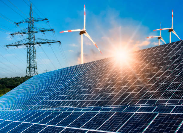 istock Photovoltaic system, wind turbine and power pole 1030878234