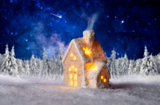 istock Small house with winter landscape and starry sky 1030878326