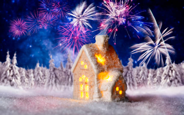 istock Small house with winter landscape and fireworks 1030878340