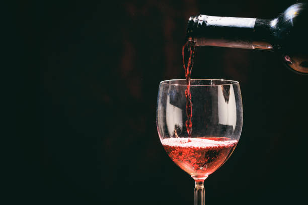 istock Red wine glass and bottle 1030882508