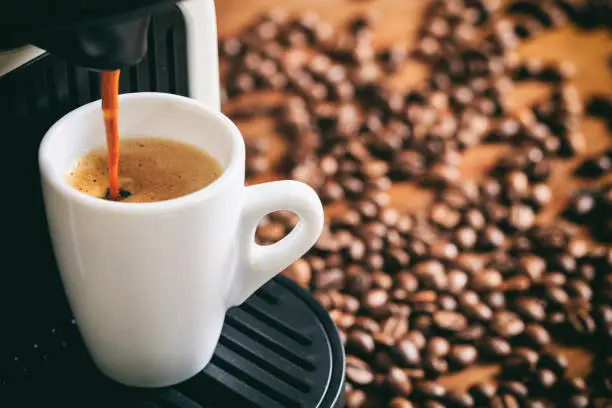 Photo of Espresso coffee and machine
